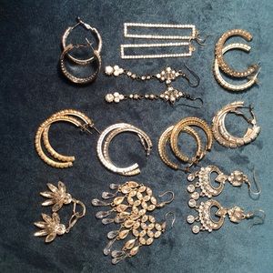 Set of 11 pairs of silver and rhinestone earrings.